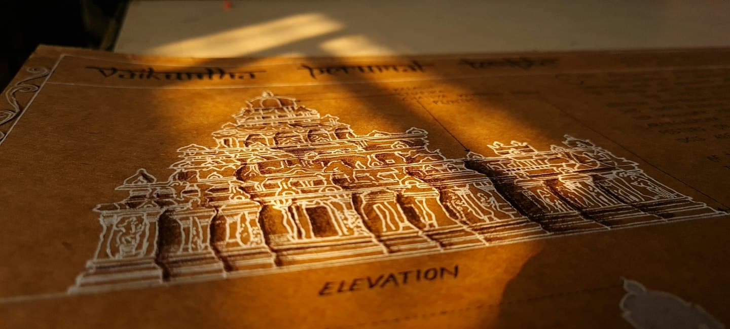 Detailed white ink drawing of a temple on brown paper.