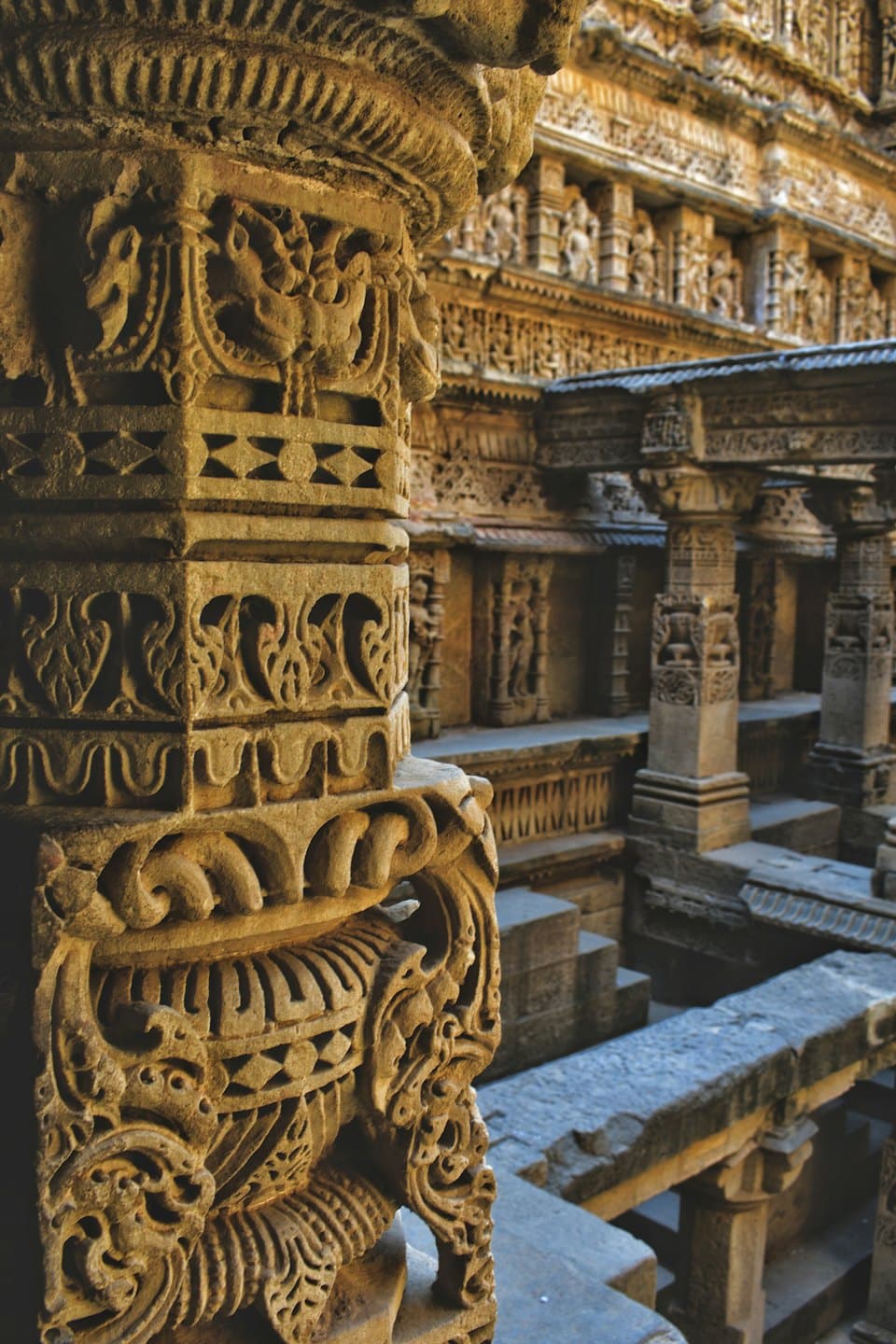 Intricate stone carvings decorate the pillars of an ancient temple.